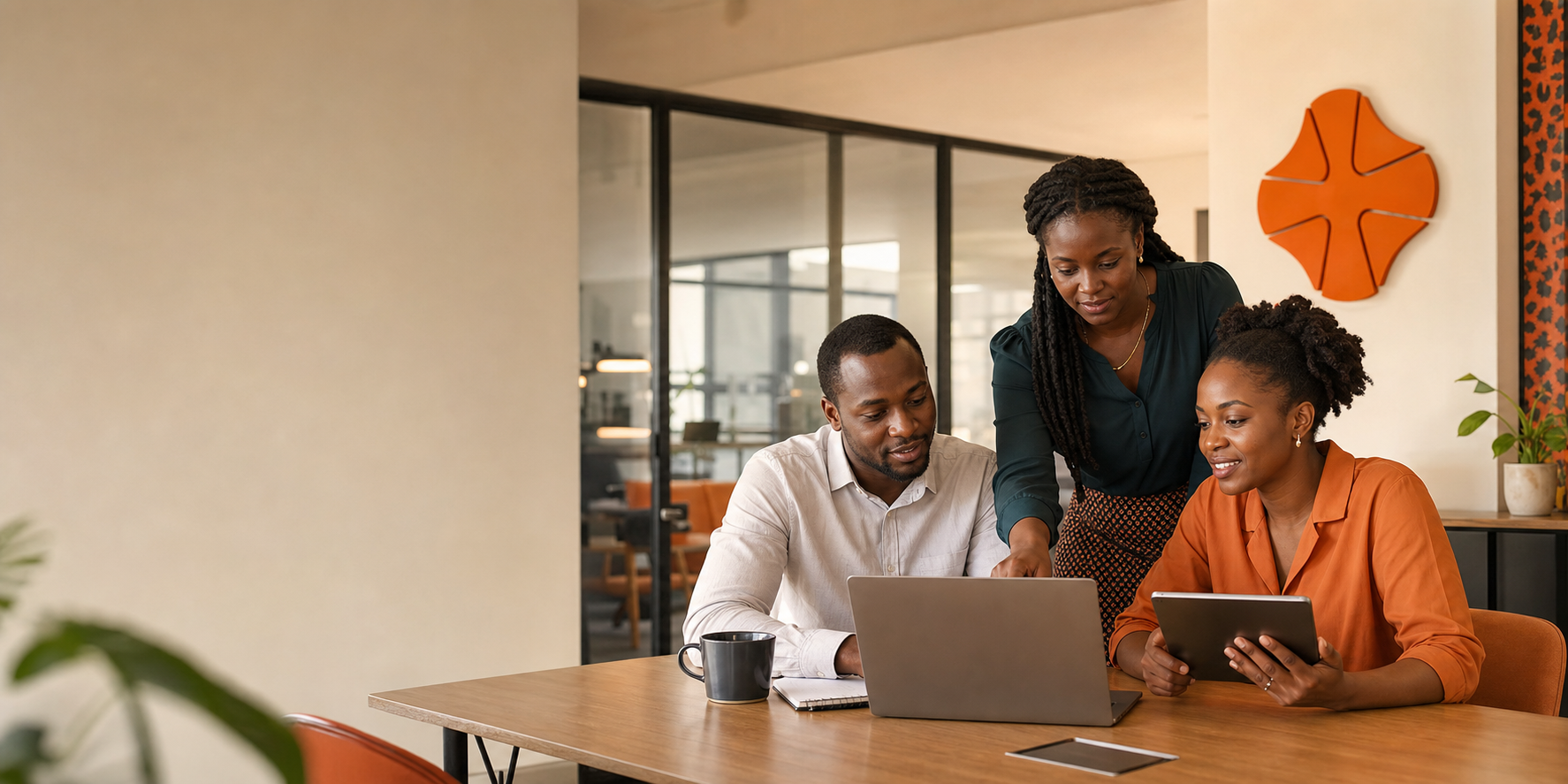 Kenyan finance and HR professionals working together in a modern payroll office